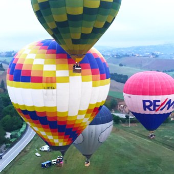 group-of-hot-air-balloons-takeoff-in-formation